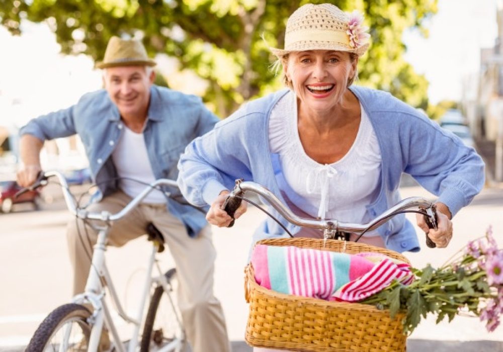 happy-mature-couple-going-bike-ride-city_13339-55187